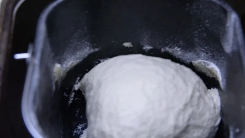 Home bread machine starts kneading dough Vídeo Stock 105346606