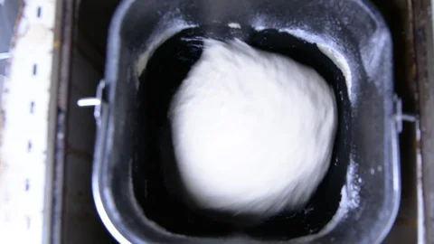 Home bread machine starts kneading dough 스톡 동영상 105347489