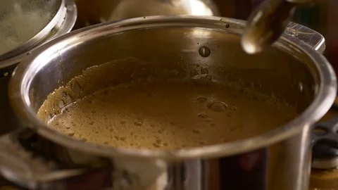 Home Brew Beer making. Boiling of a dark beer liquid in slow motion 180 to 24fps Stock Footage 74768537