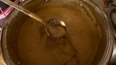 Home Brew Beer making. Boiling of a dark beer liquid in slow motion 4K Stock Footage 74769100