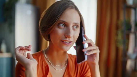 Home brunette calling cellphone discussing news closeup. Portrait relaxed woman Stock Footage 333776179