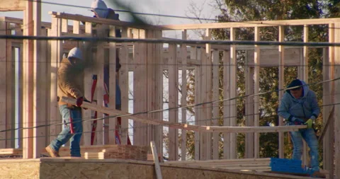 Home Builders Constructing The Wood Framing of New Homes. Vídeos de archivo 168393180