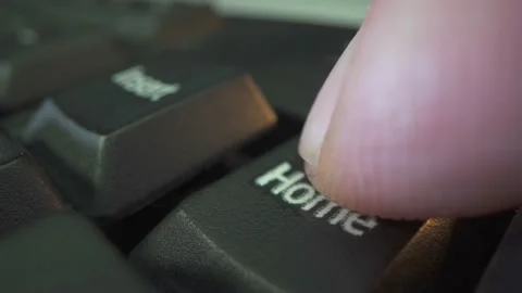 Home button on black keyboard in the end of working day. Golden hour sunset Stock Footage 141585640