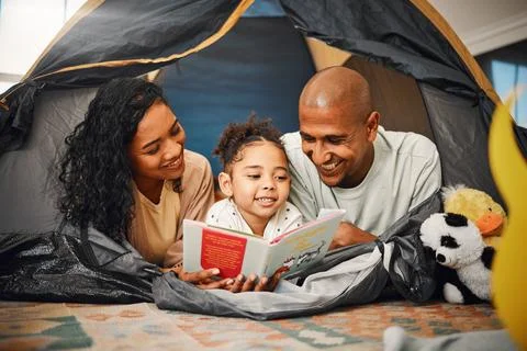 Home, camping and child reading story book, cartoon comic books and bonding with Stock Photos