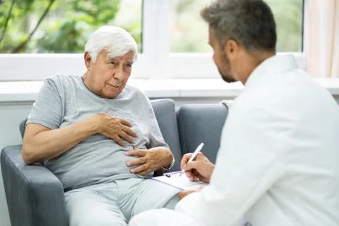 Home Care Elder Patient Talking To Doctor Stock Photos