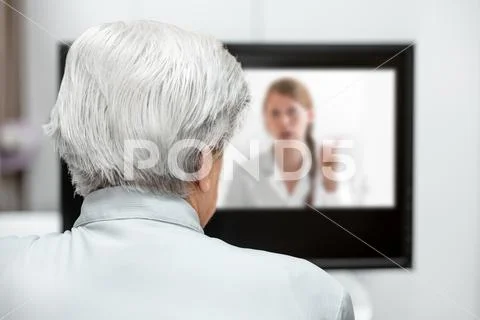 In-home care for an elderly patient with telemedicine or telehealth, virtual Stock Photos