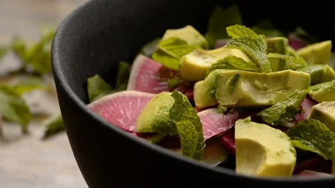 Home Chef Adding Mint to Vegetable Salad Stock Footage 116787281