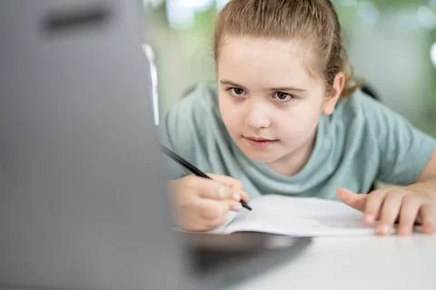 Home classroom supports remote learning. Home study uses laptop lessons. Child Stock Photos