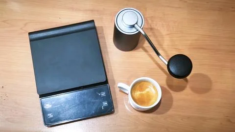 Home Coffee Brewing Setup with Espresso Cup, Manual Grinder and Digital Scale Stock Photos