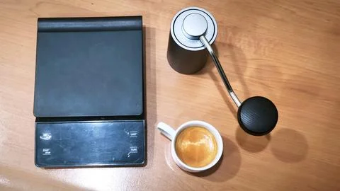 Home Coffee Brewing Setup with Espresso Cup, Manual Grinder and Digital Scale Stock Photos