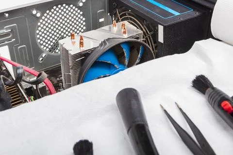 The home computer is covered in dust. cable in the mud. concept cleaning an.. Stock Photos
