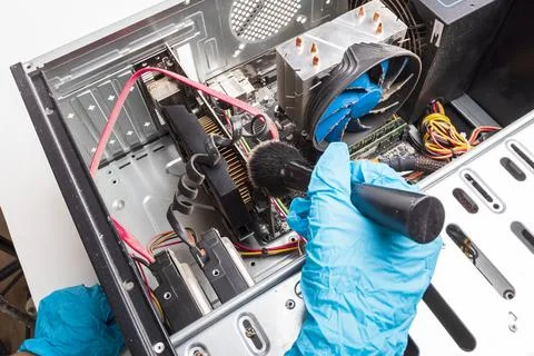 The home computer is covered in dust. cable in the mud. concept cleaning and  Stock Photos