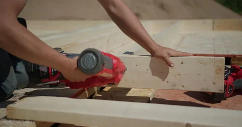 Home Construction - Nailing a 2x4 on a new house build - Lumber Costs Stock Footage 156340722