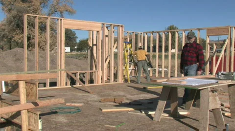 Home construction supervisor carpenters plans M HD Stock Footage 277436