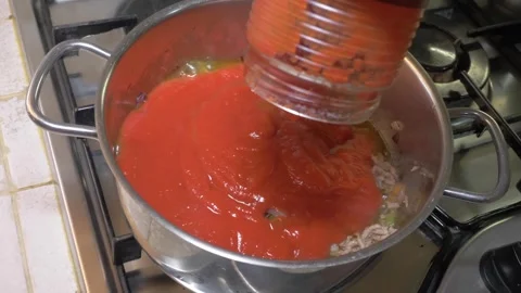 Home Cook Adding Tomato Sauce to Ground Meat Cooking in a Pot Stock-Footage 337955102