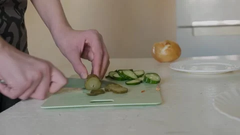 Home cook chopping cucumber Stock Footage 339972958