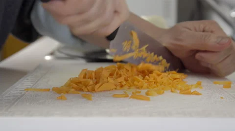 Home cook dicing carrots. 4K UHD. 库存影片 49970438