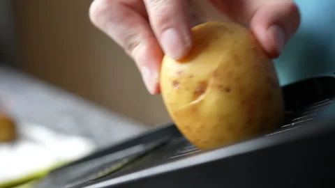 Home Cook Using Mandoline Slicer To Prepare Potato Gratin Stock Footage 251662348