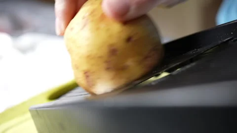 Home Cook Using Mandoline Slicer To Prepare Potato Gratin 스톡 동영상 251662704