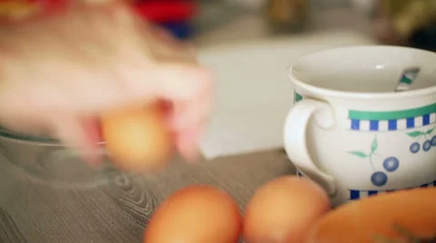 Home cooking - Breaking the eggs - close up Stock Footage 35963684