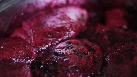 Home cooking cranberries jam macro close-up boils slowly Video stock 112914948