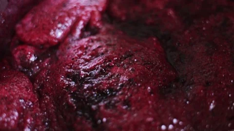 Home cooking cranberries jam macro close-up boils slowly Video stock 112915072