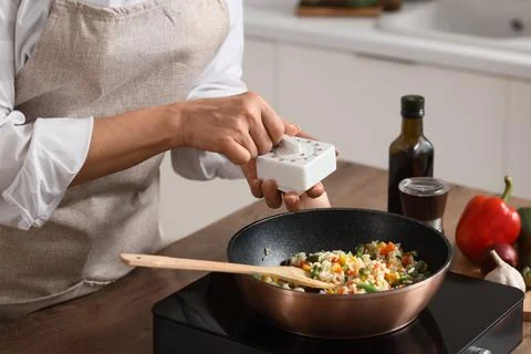 Home cooking with kitchen timer and frying pan, healthy meal preparation, cul Stock Photos