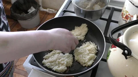 Home cooking process.  the cook prepares potato pancakes.  healthy food concept Video stock 155184320