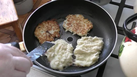 Home cooking process.  the cook prepares potato pancakes.  healthy food concept Video stock 155184482