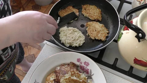 Home cooking process.  the cook prepares potato pancakes.  healthy food concept Stock Footage 155184655