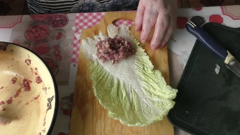 Home cooking process.  The cook prepares stuffed cabbage rolls from deer meat. Video stock 155203752