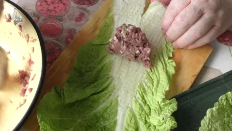 Home cooking process.  The cook prepares stuffed cabbage rolls from deer meat. Video stock 155203780