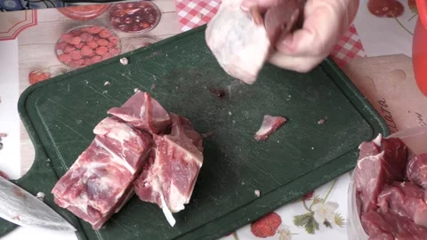 Home cooking process.  The cook washes the deer meat in water. Stock Footage 155498896