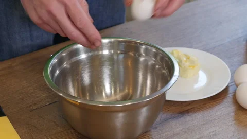 Home cooking. Process preparation dough, male hands cracking eggs Video stock 217448418