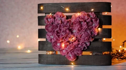 Home decor in the shape of a heart. Eco-friendly wood decor Stock Footage 220520846
