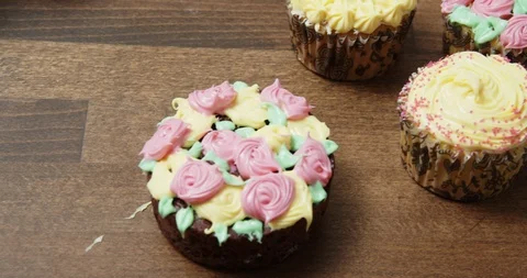 Home decorated cupcakes on a table Stock Footage 117017541