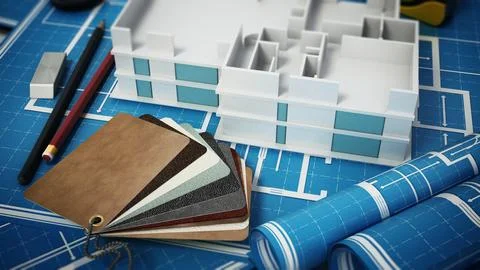 Home decorating tools standing on house bluprints. 3D illustration Ilustração Stock