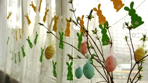 Home decoration with Easter eggs and garlands. Stock Footage 235174129