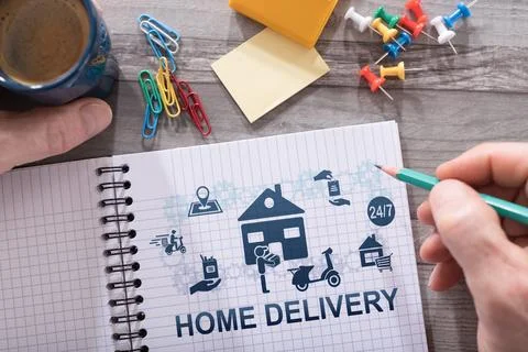Home delivery concept on a notepad Stock Photos