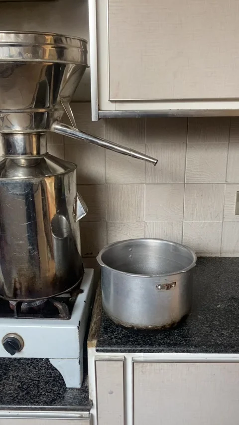 Home Distillation of Essential Oils with Stainless Steel Alembic Still Stock Footage 339229930