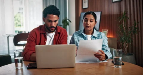 Home, documents and couple on laptop for finance review, budget planning and Stock Footage 330159844