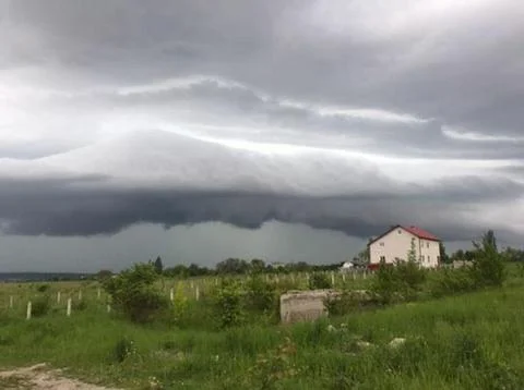 Home with dramatic sky 스톡 사진