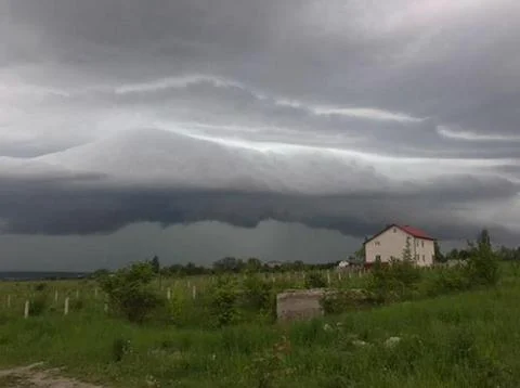 Home with dramatic sky 스톡 사진