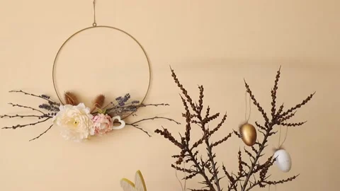Home Easter decor. Handmade spring round flower garland hanging on wall Stock-Footage 237340392