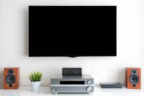 Home entertainment multimedia center in living room: tv, audio system Stock Photos