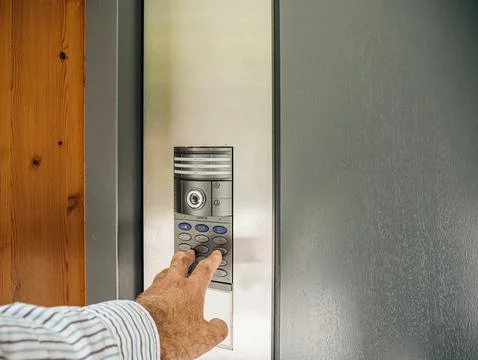 Home Entry: Man Entering with Intercom and CCTV Camera Stock Photos