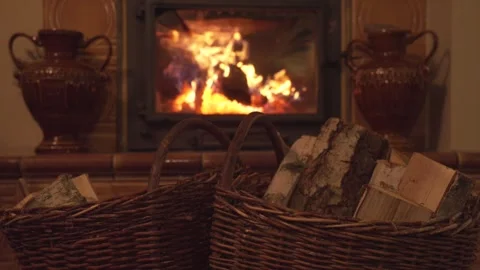 A home fire place. Barking birch firewood. Shrouded in fire. A relaxing look for Stock Footage 303862917