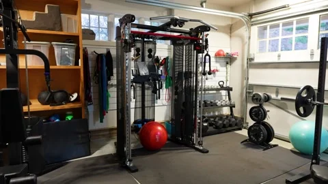 Home Garage Gym with Cable Machine and Free Weight Training Setup Stock Footage 330581795