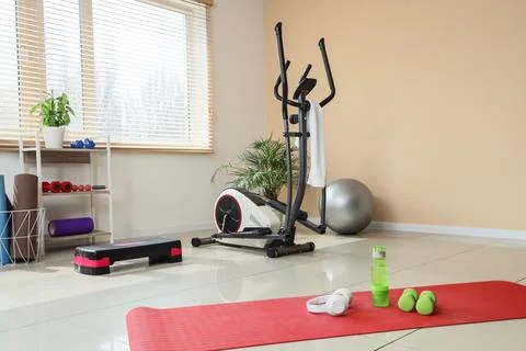 Home gym setup with exercise equipment and accessories Stock Photos