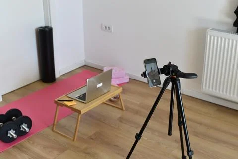 Home gym setup with an iPhone on a tripod Stock Photos